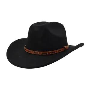 Close-up of black western cowboy hat with brown studded leather belt band for classic style.