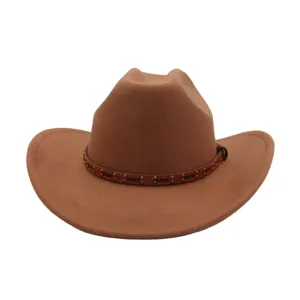 Detail view of a brown felt cowboy hat, featuring a studded leather band around the crown.