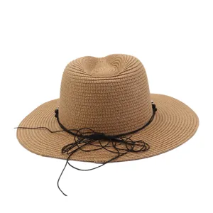 Summer beach straw hat with wide brim and black cord detail, ideal for outdoor sunny days.