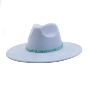 Detail view of a stylish light blue fedora hat with sparkly rhinestone crystal band