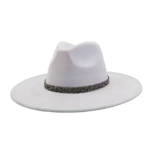 Suede fedora hat detail view, featuring a sparkly rhinestone band and wide flat brim design.