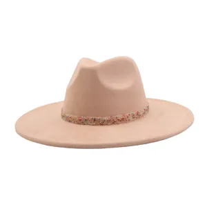 Close up detail of the sparkly beaded decorative band on the stylish wide brim suede fedora hat.