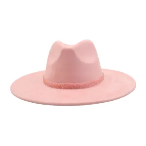 Pink suede fedora hat detail close up, showing texture and beaded hat band trim for women men.
