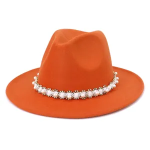 Orange wool felt fedora hat featuring elegant pearl and bead trim for women winter fashion.