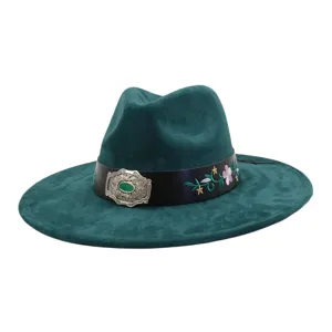 Detailed view of dark green faux suede jazz hat, featuring floral embroidery and buckle.
