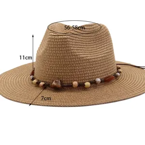 Close-up detail view of summer straw sun hat with beaded trim, showcasing size dimensions.