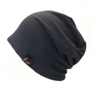 Detail shot of dark grey ribbed slouchy beanie hat, showing knit texture and side label.