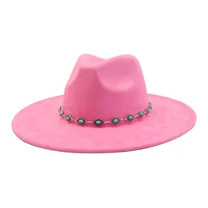 Detail view of pink felt fedora hat featuring a stunning silver turquoise bead chain band.
