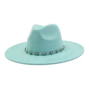 Close-up detail of the turquoise stone decorative chain on the light blue suede fedora hat.
