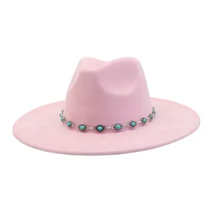 Pink suede jazz hat detail, western style turquoise chain accessory, flat brim hat.