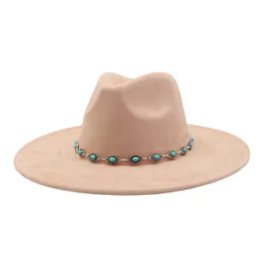 Detail view of beige felt fedora hat featuring a turquoise stone metal chain band.
