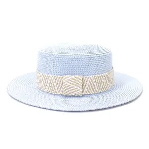 Flat top straw hat detail featuring light blue woven straw and a patterned beige band.
