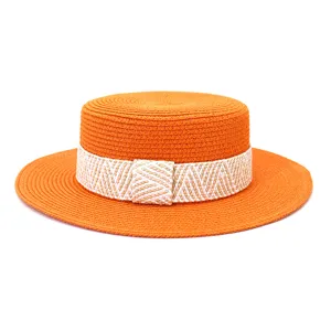 Vibrant orange straw boater hat featuring a stylish woven band for summer sun protection.