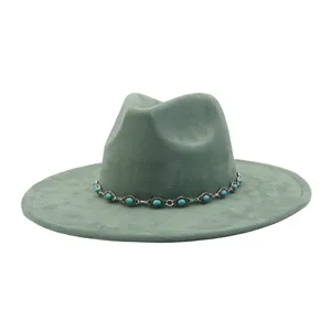 Green suede fedora hat detail featuring a turquoise stone metal chain band for women.