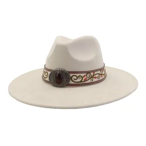 Detailed view of wide brim beige fedora hat with ethnic embroidery and amber buckle.