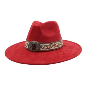 Red suede wide-brim fedora hat detail, featuring an intricate embroidered band and metal buckle.