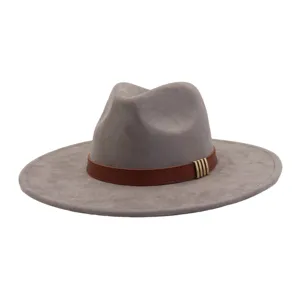 Detailed view of grey suede fedora hat featuring a stylish brown leather strap and metal decor.
