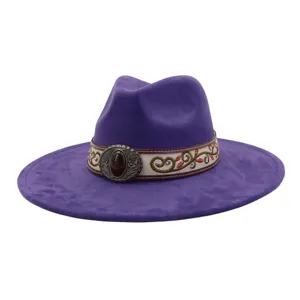 Detailed view of a purple suede fedora hat with ethnic embroidered band and gemstone buckle.