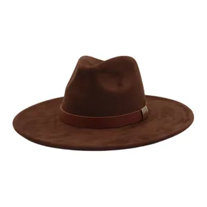 Detail view of a brown suede fedora hat with a stylish leather band and metal buckle accent.