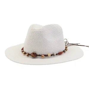 Detailed view of white straw sun hat with beaded cord, ideal for summer beach and outdoor style.