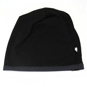 Detailed view of the black slouchy beanie hat, showing the fine knit fabric and striped brim.