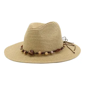 Detailed view of the summer straw sun hat featuring wide brim and decorative beaded rope.