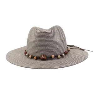 Grey straw sun hat detail view, wide brim beach hat featuring decorative beaded cord.