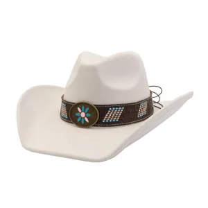 Close-up detail of the vintage western cowboy hat featuring decorative band and flower metal badge.