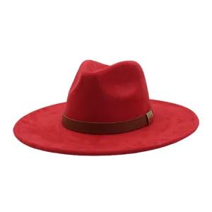 Close-up detail of the red suede fedora hat, featuring a brown leather band and metal clasp accent.