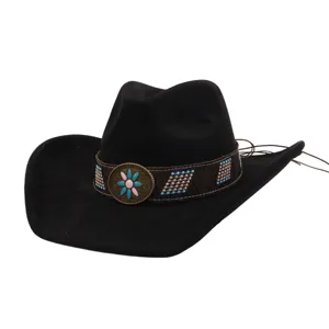 Close-up of black faux suede western cowboy hat with ethnic patterned band and turquoise flower buckle.