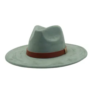 Closeup of the wide brim suede fedora hat detail featuring brown leather belt and metal buckle.