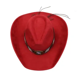 Close-up detail of the red suede cowboy hat featuring a decorated brown band and floral metal buckle.