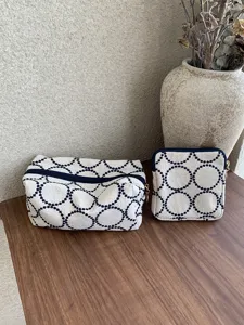 Embroidered fabric makeup bag set with cute circular pattern for daily use and travel.