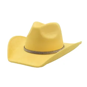 Close-up of the elegant rhinestone band and soft suede texture on the yellow cowboy hat.
