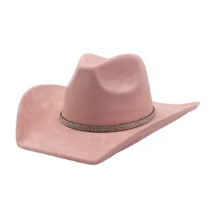 Detailed view of the pink suede cowboy hat, featuring a sparkling rhinestone band design.