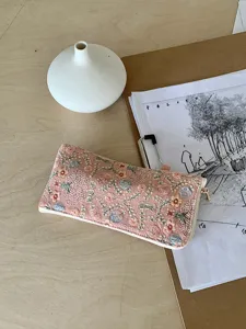 Pink floral embroidered zipper pouch, portable glasses case and stylish storage bag for daily use.