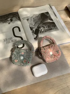 Mini quilted embroidered fabric earphone storage bag portable coin purse with handle and snap.