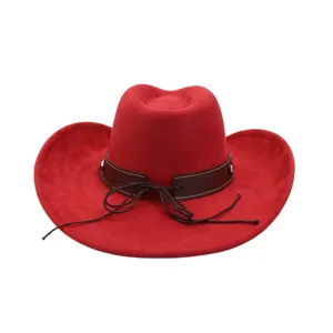 Red suede cowboy hat detail showing the stylish brown band, decorative strings, and metallic rivets.