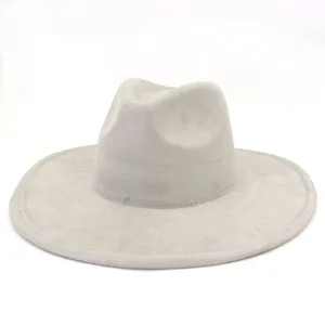 Close-up detail of grey suede fedora hat, wide brim classic gentleman style accessorizing.