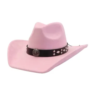 Pink suede cowboy hat detail showing black studded leather band and vintage metal concho.