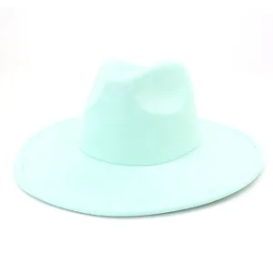 Mint green suede fedora hat detail view, soft texture fabric, classic wide brim design.