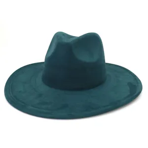 Close-up view of the dark green suede fedora hat showing fine texture and wide brim.