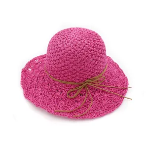 Handmade crochet straw hat for women large brim with bow detail for sun protection.