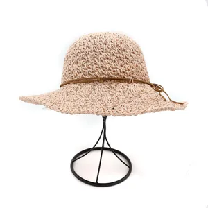 Detailed view of the summer handmade crochet straw hat with large brim and sun protection.
