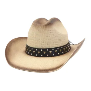 Detail shot of a vintage straw cowboy hat featuring a studded black leather band and curved brim.