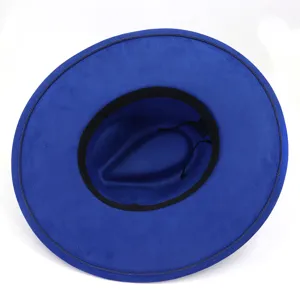 Close-up top view of blue faux suede fedora hat showing inner band and texture details.