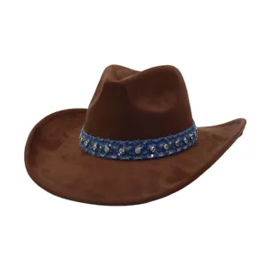 Close-up detail of a brown suede cowboy hat with a blue rhinestone-embellished denim hatband.