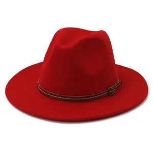 Detail view of a vibrant red wool fedora hat featuring a brown leather strap.