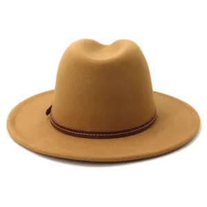 Close-up detail of camel wool fedora hat with brown leather band, stylish accessory.