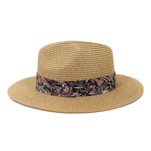 Detailed closeup view of the summer straw fedora hat featuring a vibrant paisley ribbon.
